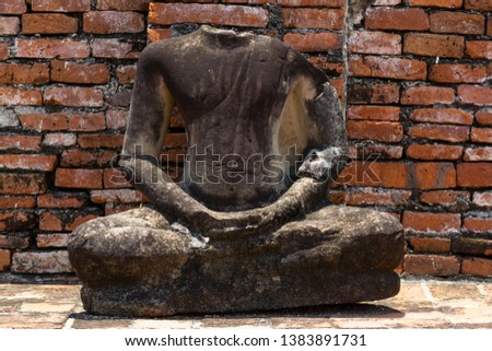 The broken Buddha Image in Ayutthaya historical park, Thailand.