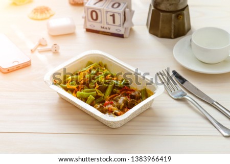 May 1st. Image of may 1, food in a container food delivery and calendar May 1 on the table. International Workers' Day