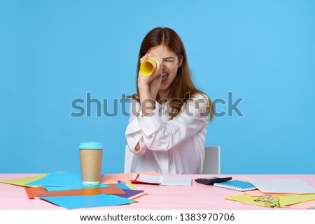 Cheerful woman sitting at a desk coffee morning work