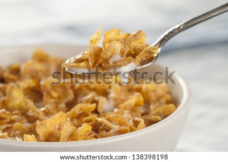 Cereal bowl and spoon with milk Royalty-Free Stock Photo #138398198