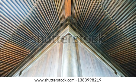 Traditional Chinese Architecture for the roof design made from wood in the corner at the temple Royalty-Free Stock Photo #1383998219