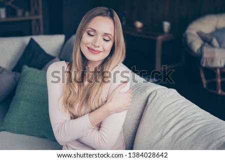 Close up photo portrait of pretty cheerful she her lady feeling good in high spirits pullover sweater people enjoying loneliness sitting on divan Royalty-Free Stock Photo #1384028642