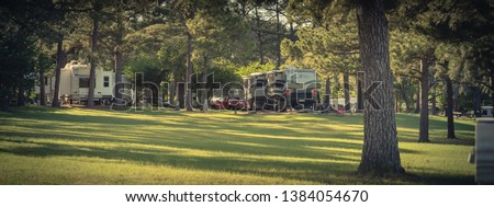 Panorama view RV campground with plenty of trees for both tent camping and RV sites in Texas, America