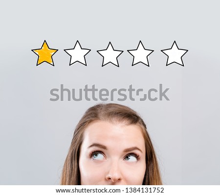 One star rating with young woman looking upwards