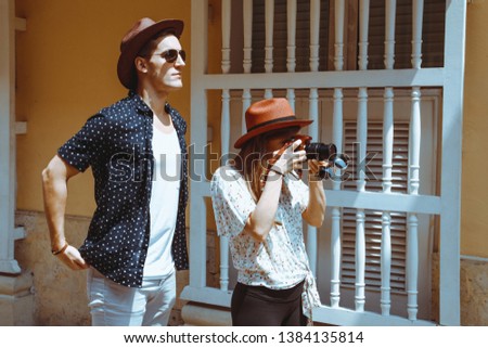 Beautiful couple walking the streets. Travel photo concept. Outdoor shot.