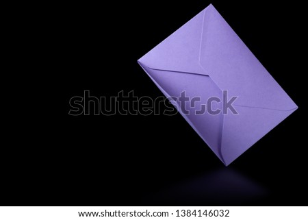 Purple envelope in the open state on a black background. The envelope is on the side.