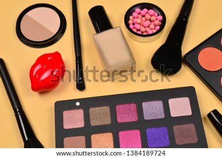 Professional makeup products with cosmetic beauty products, foundation, lipstick,  eye shadows, eye lashes, brushes and tools.