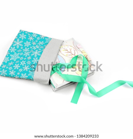 Handmade textile book in gift wrapping 
