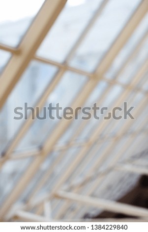 Modern architecture concept. Big sloping window blurred texture background