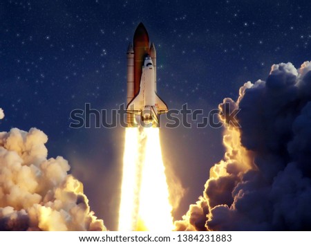 Cloudy launch of rocket into starry outer space. "The elements of this image furnished by NASA" Royalty-Free Stock Photo #1384231883