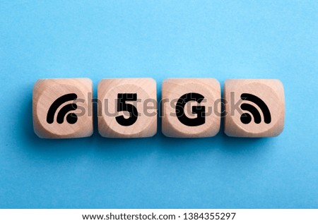 Four wooden blocks with 5G text of concept.