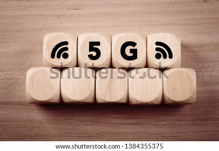 Four wooden blocks with 5G text of concept.