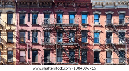 Sunlight shining on block of old buildings in the Upper East Side neighborhood in Manhattan New York City