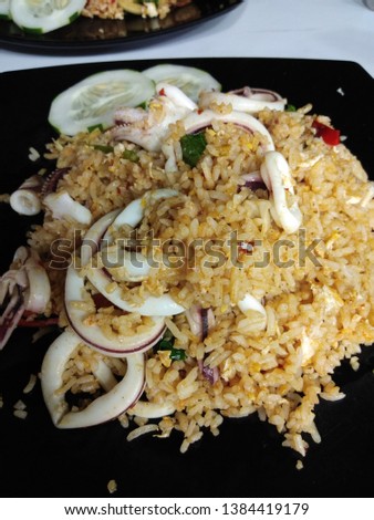 The picture of squid spicy fried rice in the plate.
