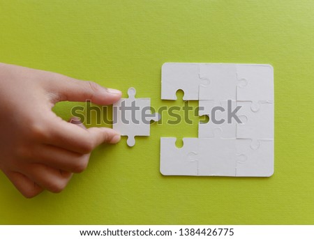 Last jigsaw puzzle piece in hand,Business success concept.