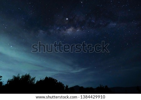 Milky way in misty sky over bromo, indonesia Royalty-Free Stock Photo #1384429910