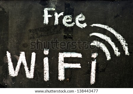 Free wifi symbol written on blackboard
