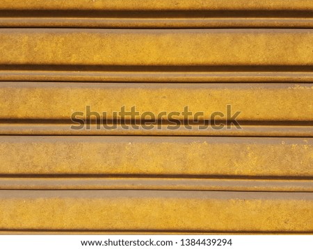The background is made of old yellow iron with patterns.