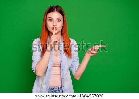 Close up photo beautiful funky she her foxy lady amazed hold hand arm finger indicate empty space advising low price ask keep silence wear casual jeans denim shirt isolated green bright background