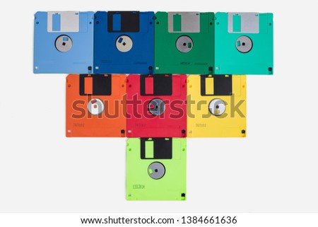 Color mix of old 3.5 diskettes forming a heart for background
