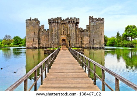 Castle and surrounding pond Royalty-Free Stock Photo #138467102