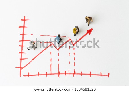 Miniature people on paper with painted financial chart and arrow 
