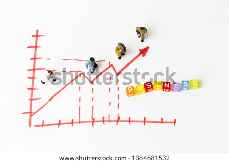 Miniature people on paper with painted financial chart and arrow 