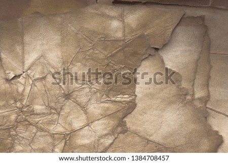 Aged paper sheet. Blank old background with dust and dirty stains. Vintage and antique art concept. Poster mockup. Detailed closeup studio shot. Front view. Toned