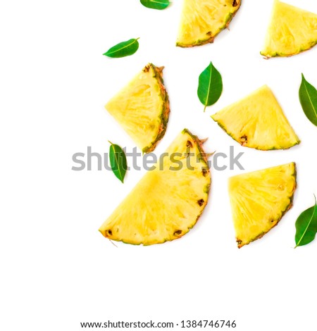 Summer Pattern with Slices of Pineapple Isolated. Exotic fruit Pineapple pieces with green mint leaves on white background. Flat lay.