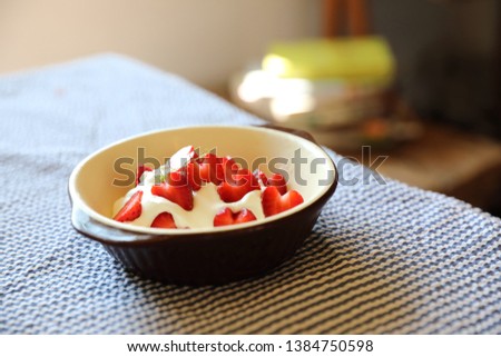 Strawberry with cream on table dessert