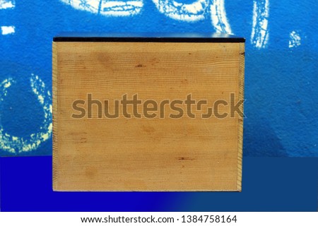  Wooden box isolated blue background.Cover,clipping path.       