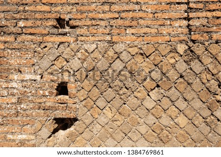 Close-up of an ancient Roman brick wall in Ostia Antica, Roman colony founded in the 7th century BC. near Rome, UNESCO world heritage site. Latium, Italy, Europe