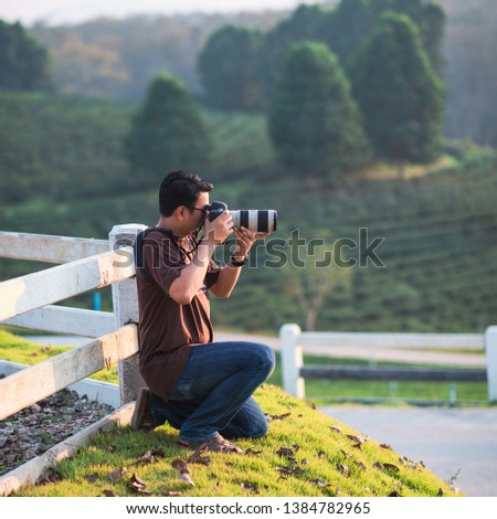 photographer taking photo of the moutain