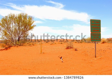 Sign board for 24 hour overnight camping allowed, Red Centre Australia