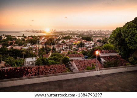 Aerial view of the historic cities of Olinda and Recife in Pernambuco, Brazil at sunset.