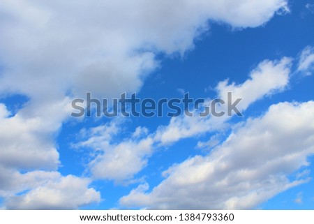 Blue sky and cumulus clouds. Background. Landscape.