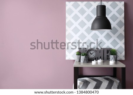 Interior of room with table and color wall