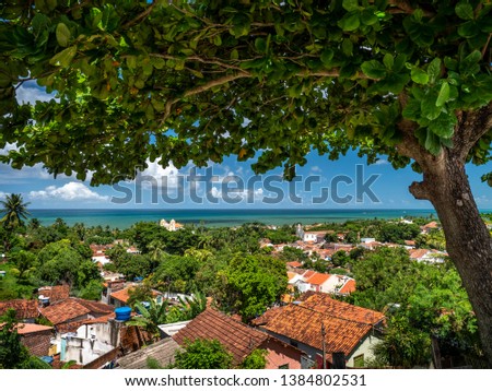Aerial view of Olinda in Pernambuco, Brazil showcasing its historic buildings dated from the 17th century in the Atlantic Forest on a sunny day.