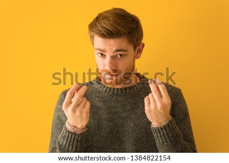 Young redhead man face closeup doing a gesture of need