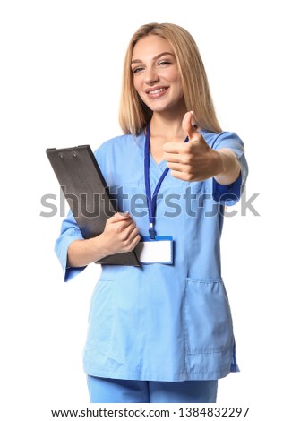 Female medical assistant showing thumb-up on white background