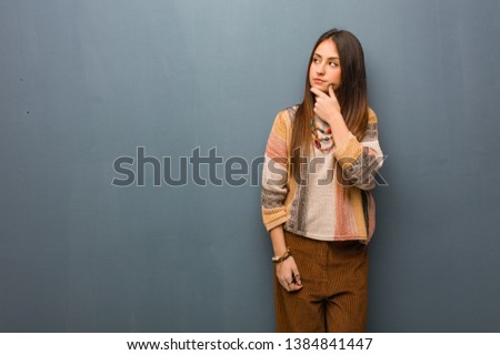 Young hippie woman thinking about an idea