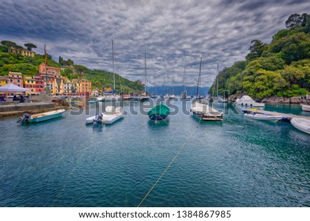 A cloudy day at colorful Portofin, Italy  -  Italian fishing village, holiday resort famous for its picturesque harbour and celebrity and artistic visitors.