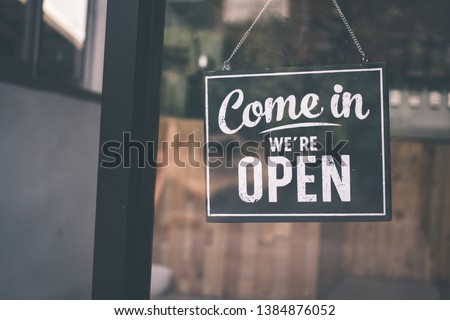 Come in we're open, vintage black retro sign Royalty-Free Stock Photo #1384876052