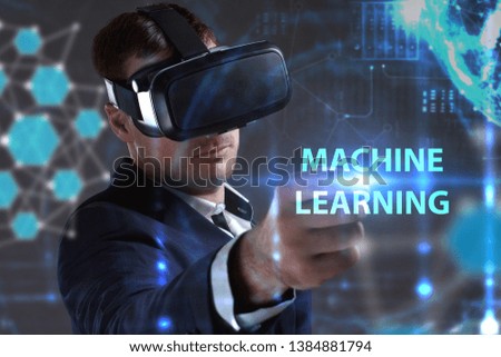 Business, Technology, Internet and network concept. Young businessman working in virtual reality glasses sees the inscription: Machine learning