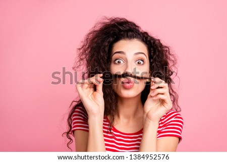 Close up photo portrait of cute glad joking humorous laughing she her lady holding curl over mouth sending air pouted blow plump kiss to you isolated pastel pop background