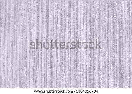 Chaotically painted grey wall with white paint drops. Background with plaster and stains. White wall texture with paint drops.