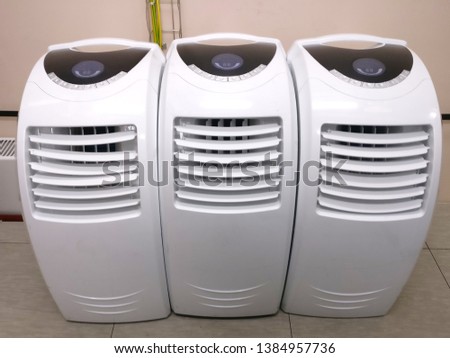 Mobile air conditioning system in the office. Portable air conditioners in shop. Portative acooling system in the supermarket.