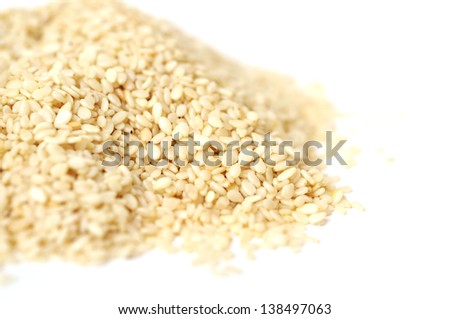 a pile of sesame seeds on white
