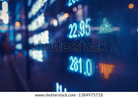 Financial stock exchange market display screen board on the street, selective focus