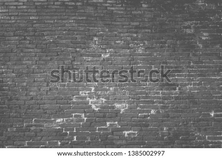 Antique Gray black brick wall of red color.texture grunge background.may use to interior design.